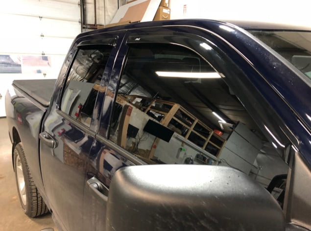 Window tinting on a pickup truck at CozyCar in Kingston.