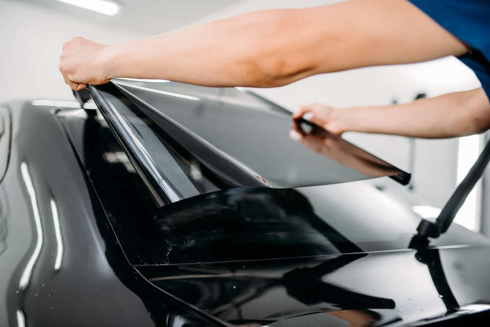 car window tinting being applied